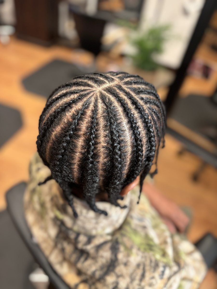 Intricate cornrow braids — precision styling